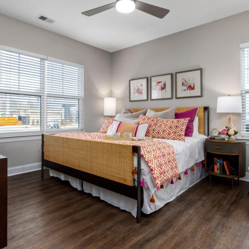 a bedroom with a bed and a chair