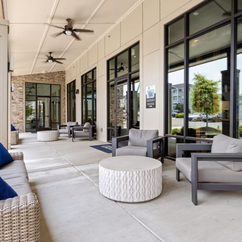 couch and chairs outside a building